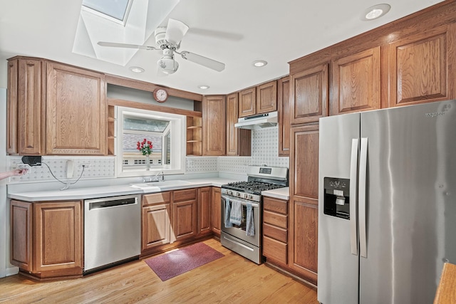 108 6th St, Downers Grove, IL 60515 - kitchen featuring appliances with stainless steel finishes, open shelves, under cabinet range hood, light countertops, and recessed lighting