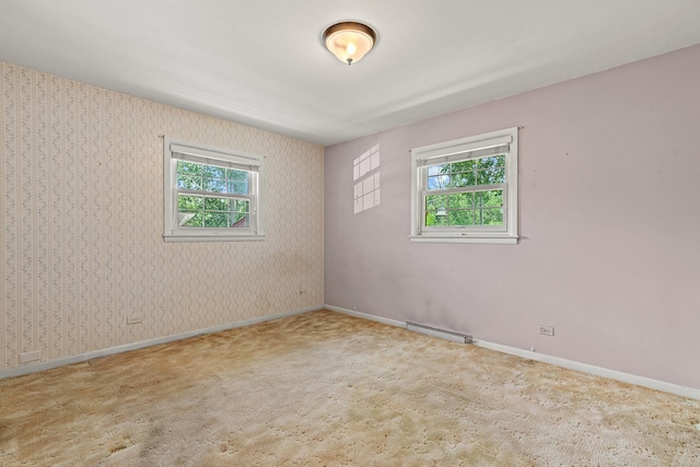 108 6th St, Downers Grove, IL 60515 - carpeted empty room with baseboards and a baseboard radiator