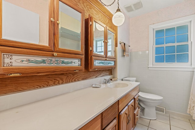 108 6th St, Downers Grove, IL 60515 - bathroom with tile walls, tile patterned floors, vanity, and a wainscoted wall