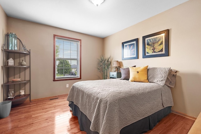 3034 Warwickshire Dr, Machesney Park, IL 61115 - bedroom featuring wood finished floors and baseboards
