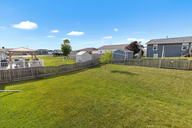 3034 Warwickshire Dr, Machesney Park, IL 61115 - fenced backyard featuring a residential view and a gazebo