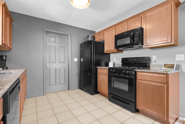3034 Warwickshire Dr, Machesney Park, IL 61115 - kitchen with black appliances and light stone counters