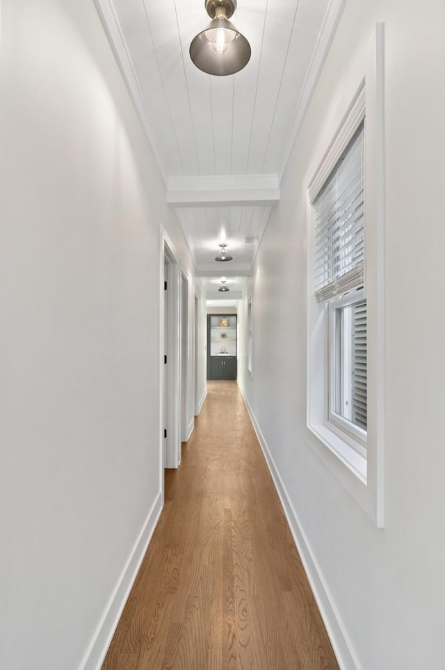 1116 W Addison St, Chicago, IL 60613 - corridor featuring wood finished floors, ornamental molding, and beamed ceiling