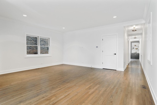 1116 W Addison St, Chicago, IL 60613 - unfurnished room featuring ornamental molding, light wood-type flooring, and recessed lighting