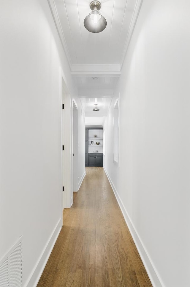 1116 W Addison St, Chicago, IL 60613 - corridor featuring wood finished floors and ornamental molding