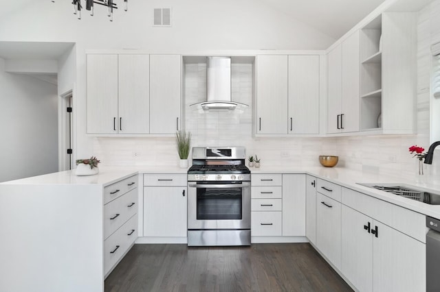 1116 W Addison St, Chicago, IL 60613 - kitchen with wall chimney range hood, stainless steel gas range oven, open shelves, decorative backsplash, and light countertops