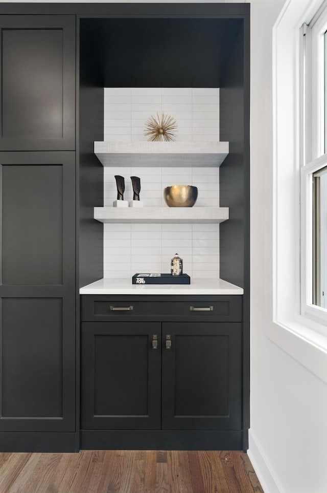 1116 W Addison St, Chicago, IL 60613 - bar featuring dark wood-style flooring and baseboards
