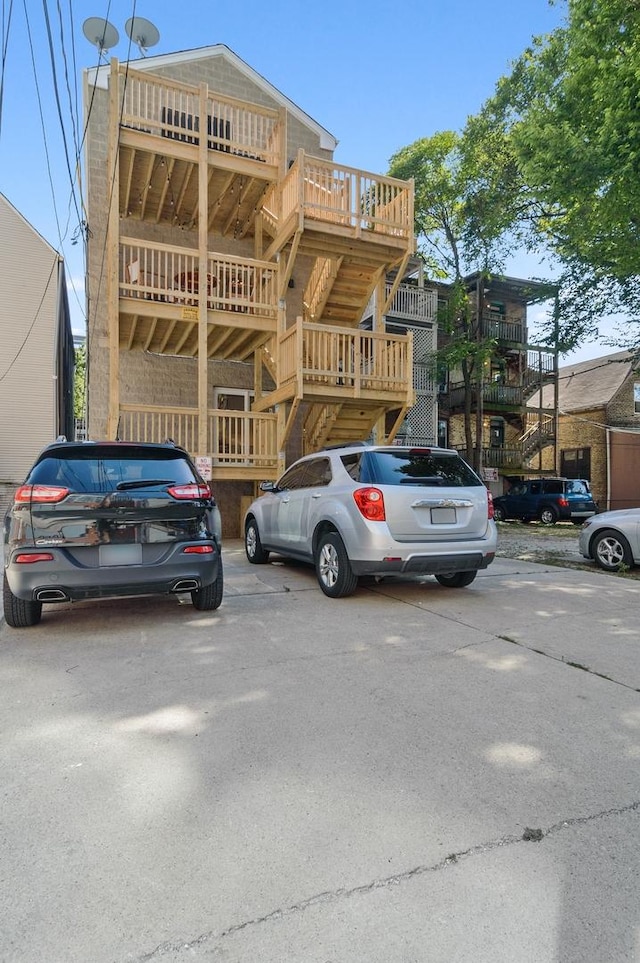 1116 W Addison St, Chicago, IL 60613 - view of building exterior with uncovered parking and stairway