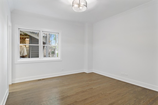 1116 W Addison St, Chicago, IL 60613 - unfurnished room with crown molding and wood finished floors
