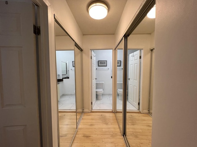 230 E Ontario St Unit 905, Chicago, IL 60611 - hallway featuring light wood-style floors