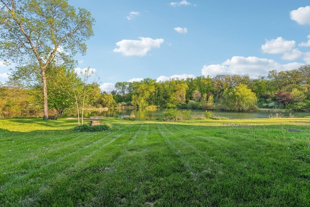 15810 Il Route 173 Unit 1D, Harvard, IL 60033 - view of grassy yard featuring a water view