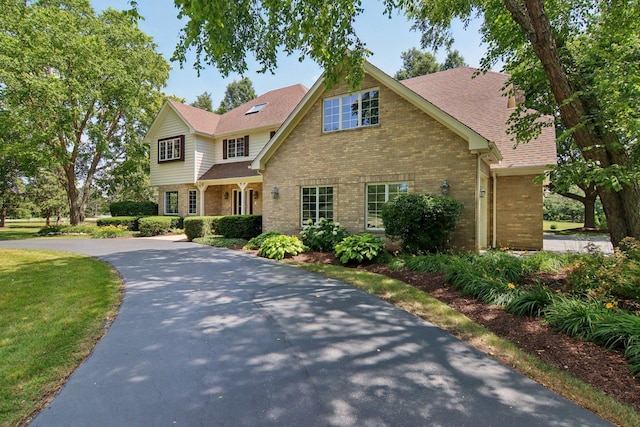 13 Wind Ridge Rd, South Barrington, IL 60010 - traditional-style house with brick siding, driveway, and roof with shingles