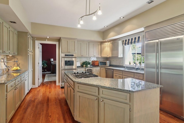 13 Wind Ridge Rd, South Barrington, IL 60010 - kitchen with stainless steel appliances, a kitchen island, decorative backsplash, and wood finished floors