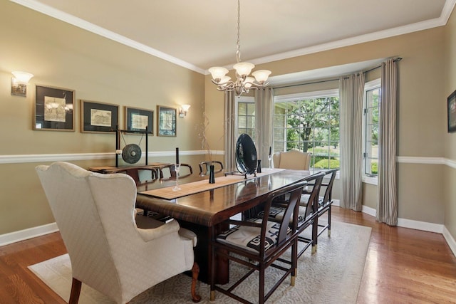 13 Wind Ridge Rd, South Barrington, IL 60010 - dining area featuring a chandelier, wood finished floors, and ornamental molding
