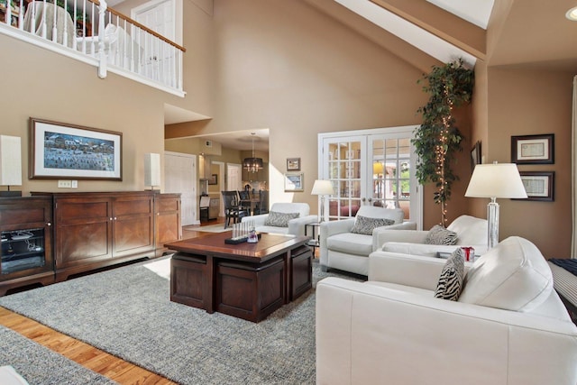 13 Wind Ridge Rd, South Barrington, IL 60010 - living room featuring high vaulted ceiling, wood finished floors, french doors, beam ceiling, and a chandelier