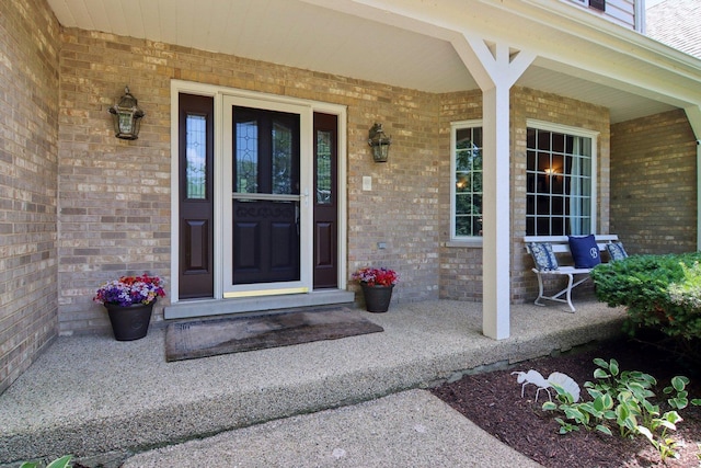 13 Wind Ridge Rd, South Barrington, IL 60010 - doorway to property featuring covered porch and brick siding