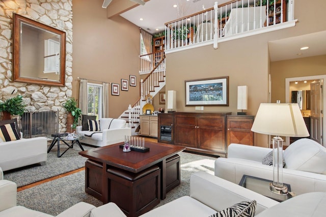 13 Wind Ridge Rd, South Barrington, IL 60010 - living room featuring a high ceiling, stairway, recessed lighting, and a stone fireplace