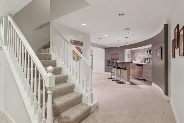 13 Wind Ridge Rd, South Barrington, IL 60010 - stairway with wet bar, carpet flooring, and recessed lighting