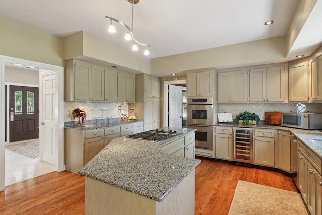 13 Wind Ridge Rd, South Barrington, IL 60010 - kitchen featuring beverage cooler, stainless steel appliances, a center island, light stone counters, and tasteful backsplash