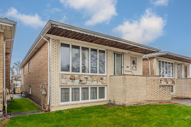 6102 W 64th St, Chicago, IL 60638 - back of house with a lawn and brick siding