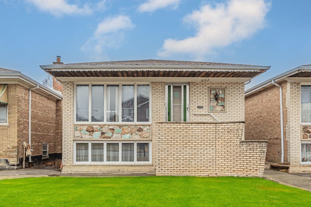 6102 W 64th St, Chicago, IL 60638 - back of property with a lawn, brick siding, and roof with shingles