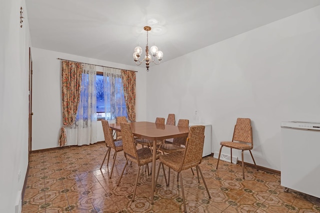 6102 W 64th St, Chicago, IL 60638 - dining area featuring tile patterned floors and a chandelier