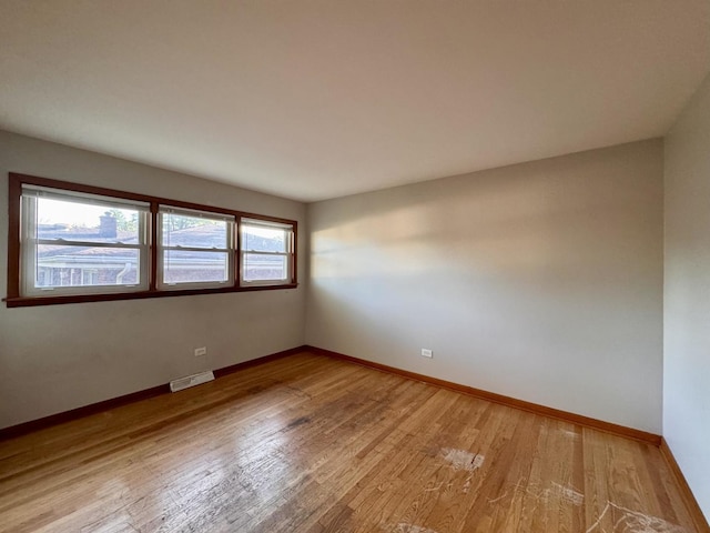 16850 School St, South Holland, IL 60473 - spare room featuring light wood-style flooring and baseboards