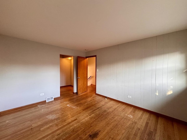 16850 School St, South Holland, IL 60473 - empty room with baseboards and wood finished floors