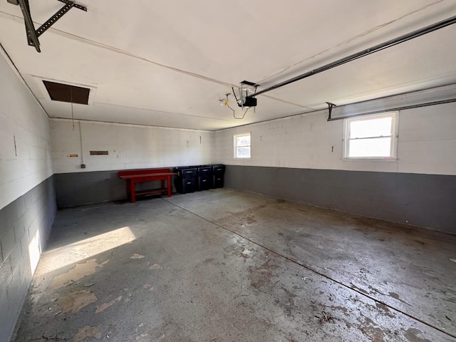 16850 School St, South Holland, IL 60473 - garage featuring a garage door opener and concrete block wall