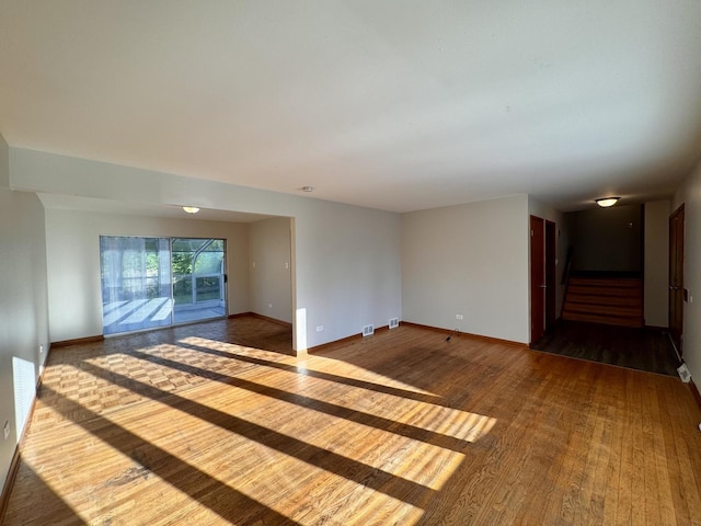 16850 School St, South Holland, IL 60473 - empty room featuring wood finished floors and stairway