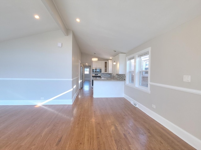 1747 E 92nd Pl, Chicago, IL 60617 - unfurnished living room featuring light wood finished floors and recessed lighting