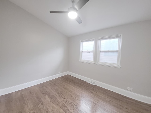 1747 E 92nd Pl, Chicago, IL 60617 - spare room featuring a ceiling fan, wood finished floors, and vaulted ceiling