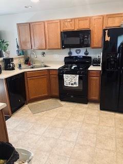 1463 Carlisle Ln, Hampshire, IL 60140 - kitchen featuring black appliances, light countertops, recessed lighting, and a peninsula
