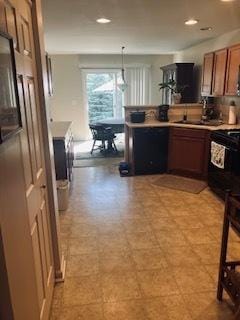 1463 Carlisle Ln, Hampshire, IL 60140 - kitchen featuring range, brown cabinetry, black dishwasher, recessed lighting, and a peninsula