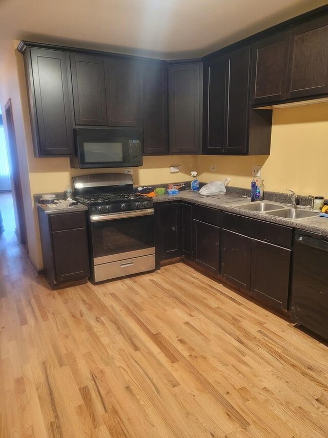 8344 S Mackinaw Ave, Chicago, IL 60617 - kitchen with black appliances and light wood-type flooring