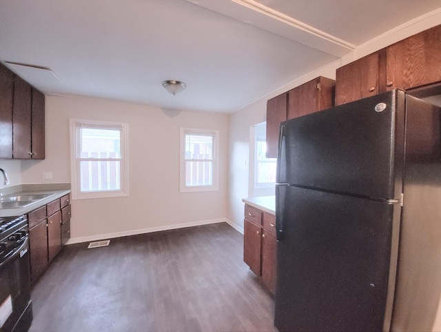 14610 Sawyer Ave, Midlothian, IL 60445 - kitchen featuring freestanding refrigerator, dark wood finished floors, stove, and light countertops