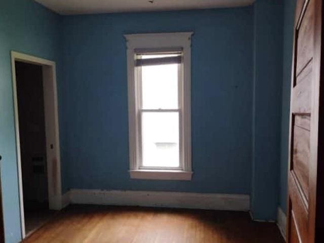 1022 N 3rd St, Springfield, IL 62702 - unfurnished room with healthy amount of natural light and wood finished floors