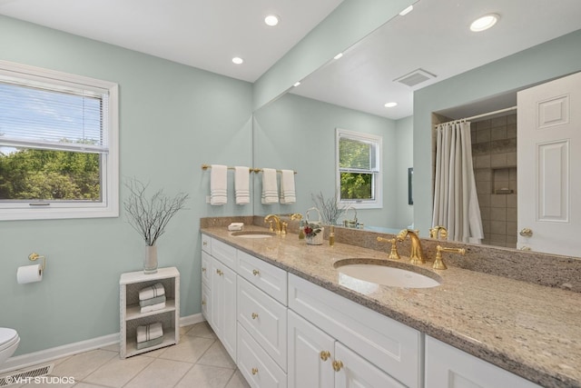 375 Sunset Dr, Northfield, IL 60093 - full bath featuring double vanity, tile patterned flooring, a shower with shower curtain, and recessed lighting