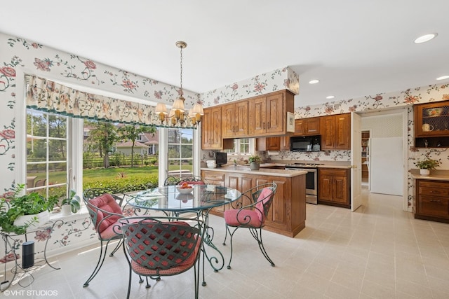 375 Sunset Dr, Northfield, IL 60093 - dining area featuring wallpapered walls, a chandelier, and recessed lighting