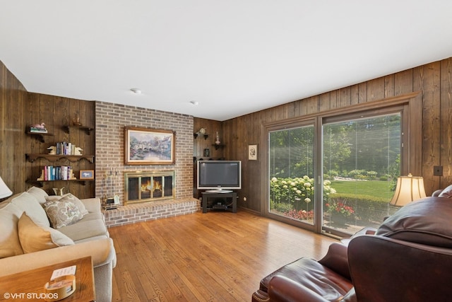 375 Sunset Dr, Northfield, IL 60093 - living room with wooden walls, a fireplace, and wood finished floors
