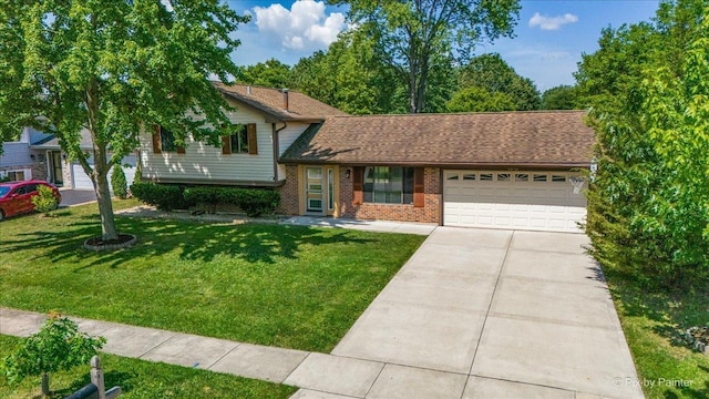 3920 Greenbay Dr, Hanover Park, IL 60133 - tri-level home with a garage, concrete driveway, brick siding, and a front yard