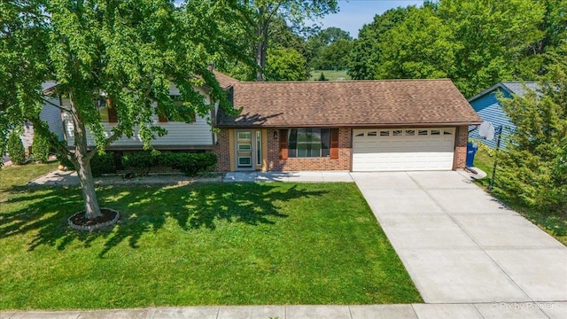 3920 Greenbay Dr, Hanover Park, IL 60133 - split level home featuring a garage, brick siding, a front lawn, concrete driveway, and roof with shingles