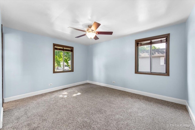 3920 Greenbay Dr, Hanover Park, IL 60133 - carpeted spare room with plenty of natural light and a ceiling fan