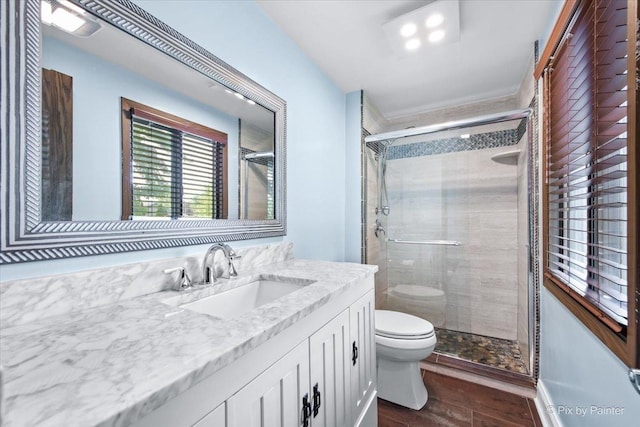 3920 Greenbay Dr, Hanover Park, IL 60133 - bathroom featuring wood finished floors, vanity, and a shower stall