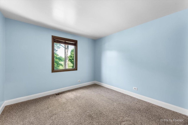 3920 Greenbay Dr, Hanover Park, IL 60133 - carpeted spare room with baseboards