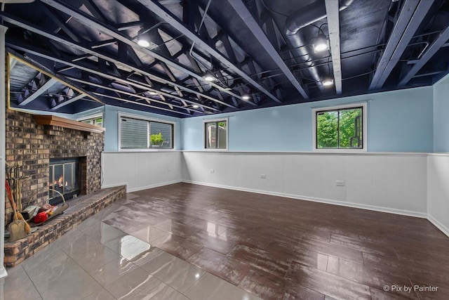 3920 Greenbay Dr, Hanover Park, IL 60133 - basement featuring wainscoting, a fireplace, and wood finished floors