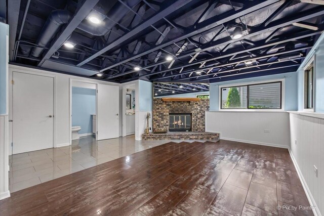 3920 Greenbay Dr, Hanover Park, IL 60133 - unfurnished living room featuring a fireplace and wood finished floors