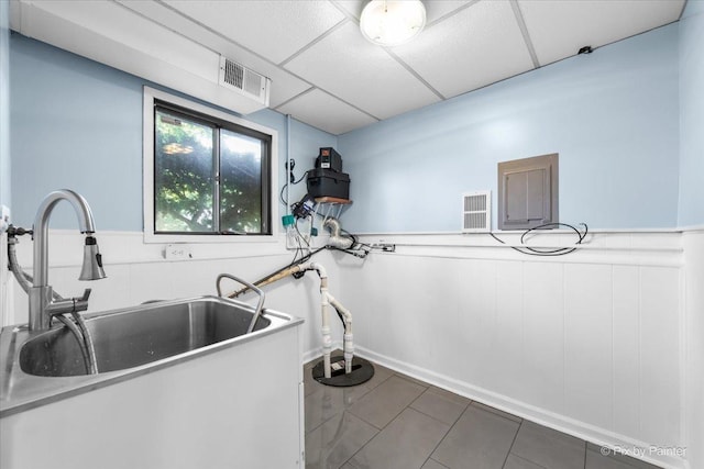 3920 Greenbay Dr, Hanover Park, IL 60133 - washroom with wainscoting and tile patterned floors