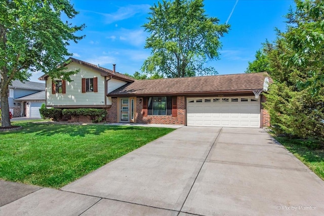 3920 Greenbay Dr, Hanover Park, IL 60133 - tri-level home with an attached garage, brick siding, concrete driveway, and a front yard