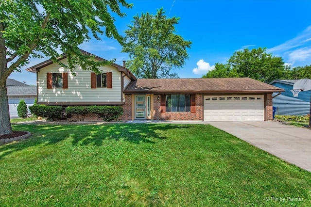 3920 Greenbay Dr, Hanover Park, IL 60133 - split level home featuring an attached garage, brick siding, concrete driveway, and a front lawn